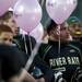 Huron High School football players hold pink balloons to support their "Real Rats Wear Pink" Campaign on Friday. Daniel Brenner I AnnArbor.com
